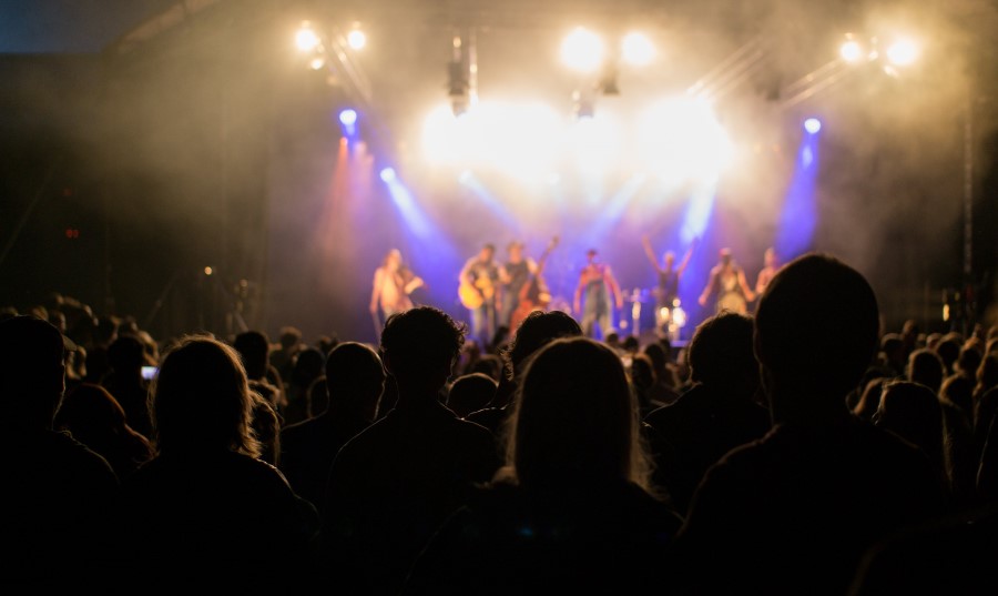 People are listening to the music band at the concert